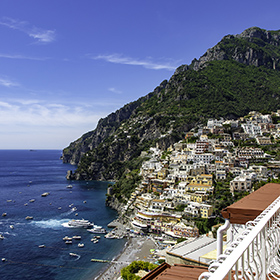 Having an Aperol Spritz on the cliff side village of Positano on the Amalfi Coast.